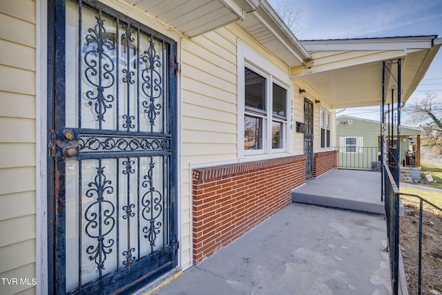 doorway to property featuring a porch