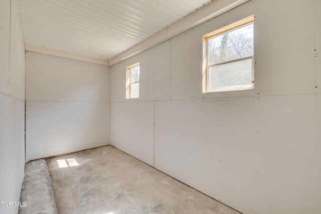 unfurnished room with concrete floors