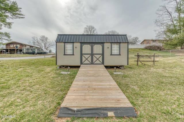 view of shed with fence