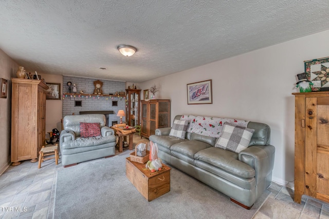 living area with a fireplace and a textured ceiling