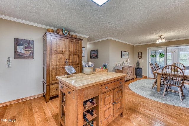 kitchen featuring open shelves, light wood-style floors, butcher block countertops, and ornamental molding