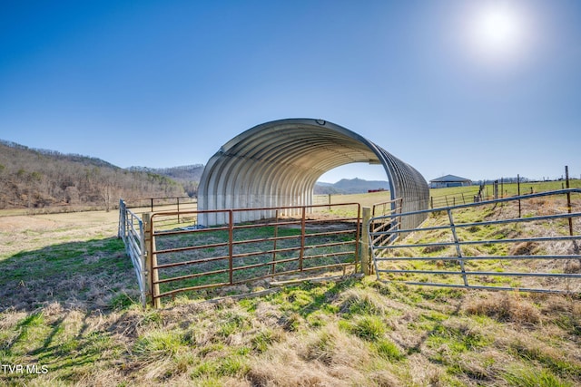 exterior space featuring a rural view and a mountain view