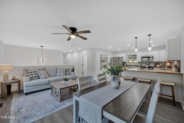 dining room featuring recessed lighting, wood finished floors, baseboards, and ceiling fan