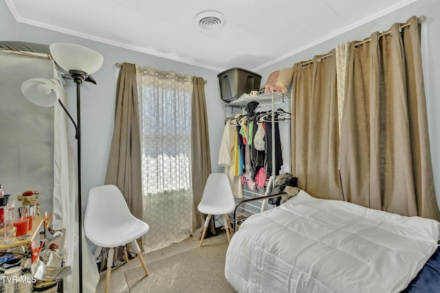 carpeted bedroom featuring visible vents and ornamental molding