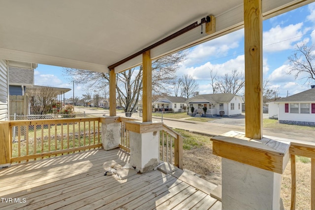 deck featuring a residential view and covered porch