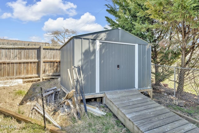 view of shed with a fenced backyard