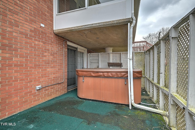 view of patio with a hot tub