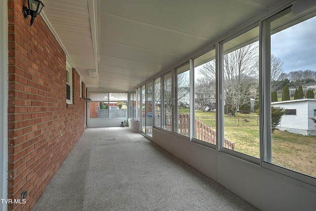 unfurnished sunroom with plenty of natural light