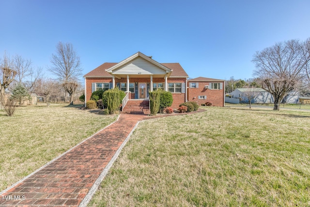 view of front of property featuring brick siding and a front lawn