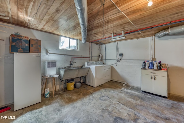 below grade area with washer / dryer, wood ceiling, and a sink