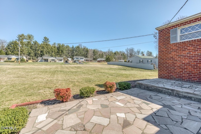 view of patio featuring fence