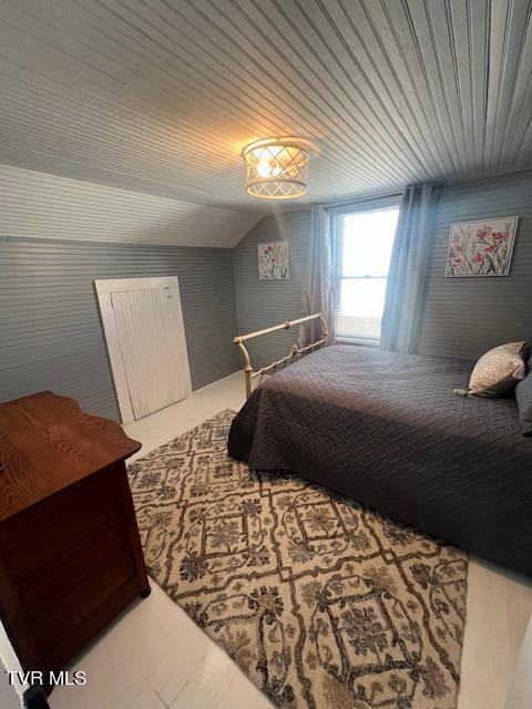 bedroom featuring wooden ceiling and vaulted ceiling