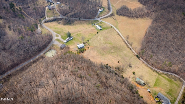 birds eye view of property featuring a rural view