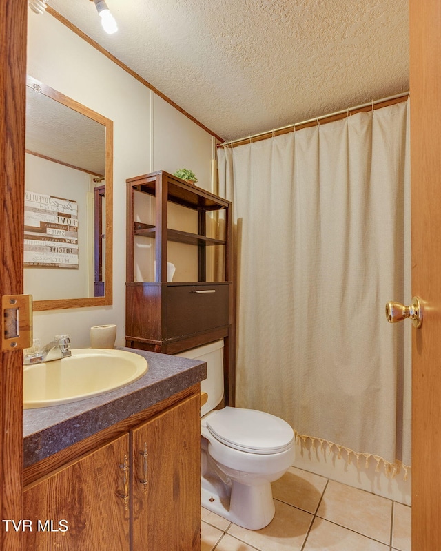 full bathroom with vanity, crown molding, a textured ceiling, tile patterned floors, and toilet