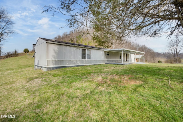 back of property with crawl space and a yard