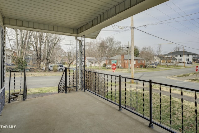 balcony featuring a residential view and covered porch