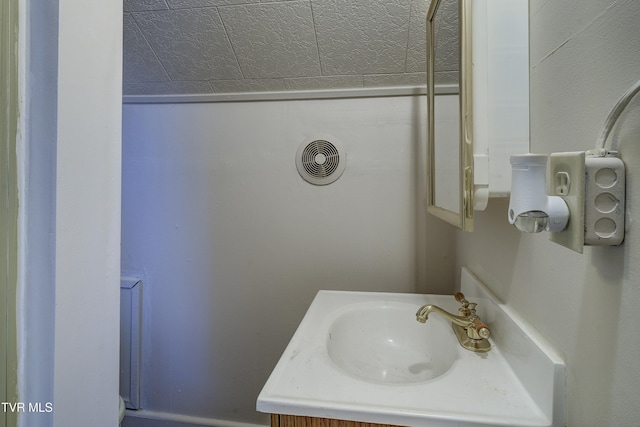 bathroom featuring visible vents and vanity