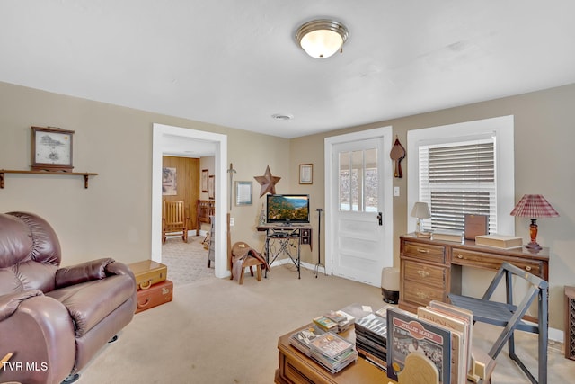 living room with baseboards and carpet flooring