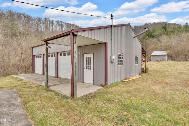 detached garage featuring driveway