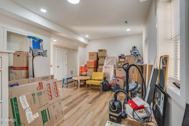 workout room featuring visible vents, recessed lighting, and wood finished floors