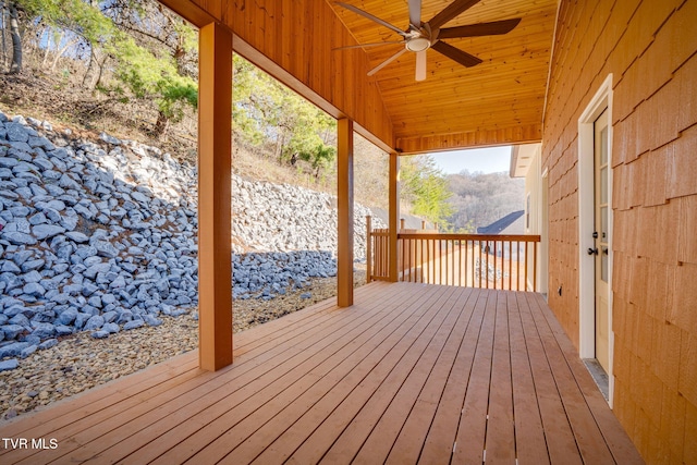 wooden terrace featuring ceiling fan