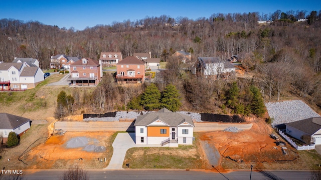 bird's eye view featuring a residential view and a view of trees