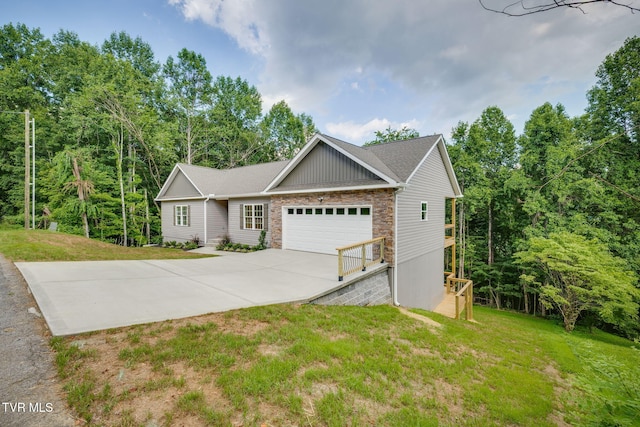 129 Stratton Pl, Kingsport, TN 37663 - view of front of house with a garage, stone siding, a front yard, and driveway
