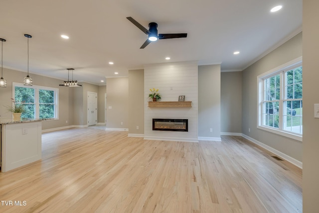129 Stratton Pl, Kingsport, TN 37663 - unfurnished living room with crown molding, a large fireplace, recessed lighting, light wood-type flooring, and ceiling fan