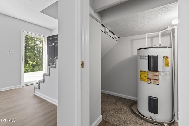 utility room featuring water heater