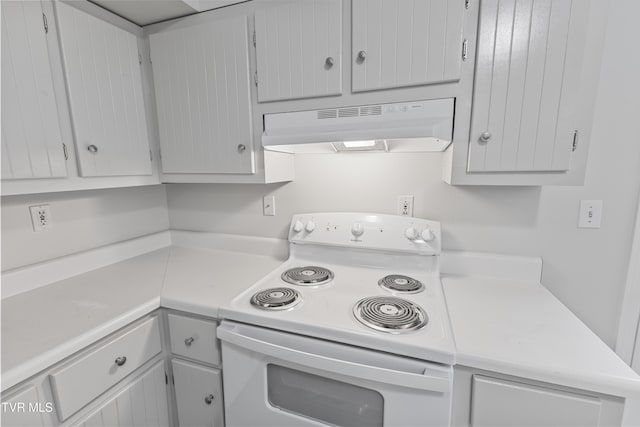 kitchen featuring under cabinet range hood, light countertops, and white electric range