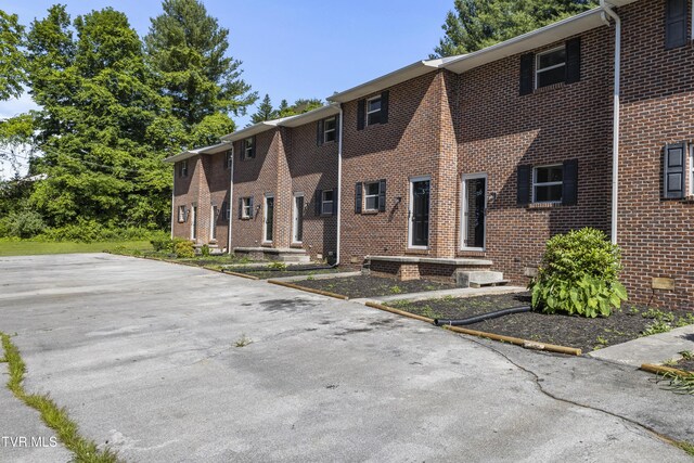 exterior space with brick siding