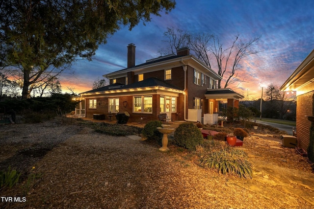 back of property featuring a chimney