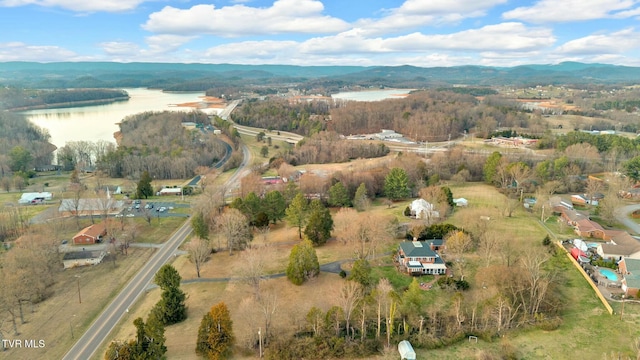 drone / aerial view with a water and mountain view