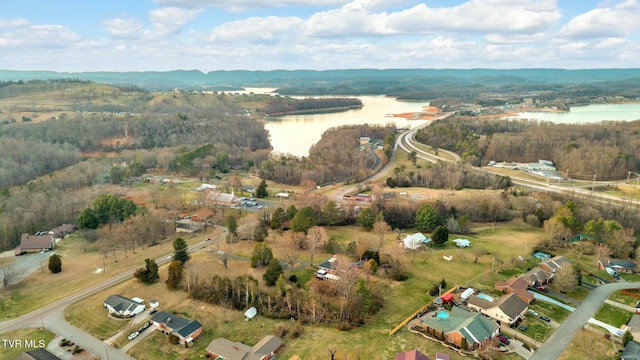 aerial view featuring a view of trees and a water view