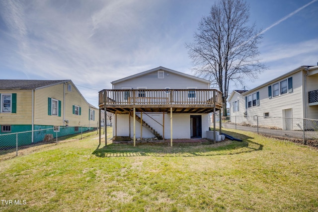 back of house with a fenced backyard, a wooden deck, stairs, and a yard