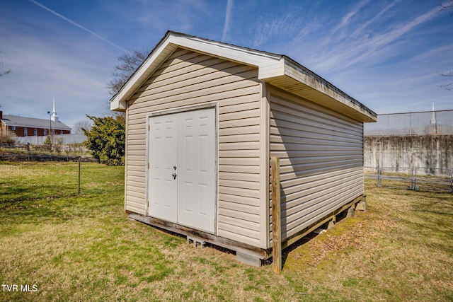 view of shed with fence