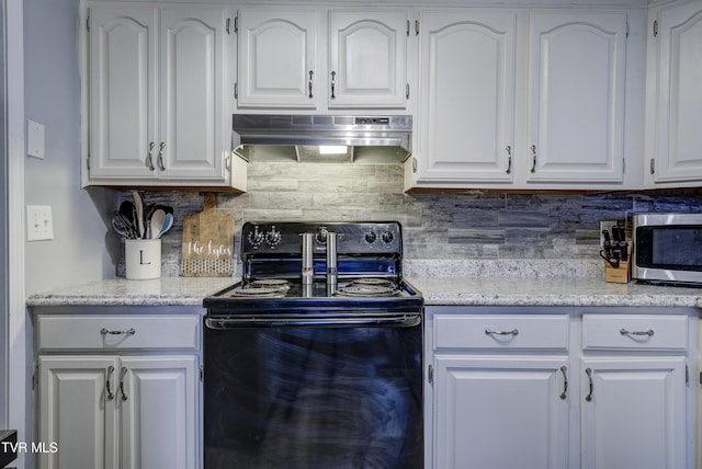 kitchen featuring under cabinet range hood, tasteful backsplash, black range with electric stovetop, and white cabinets