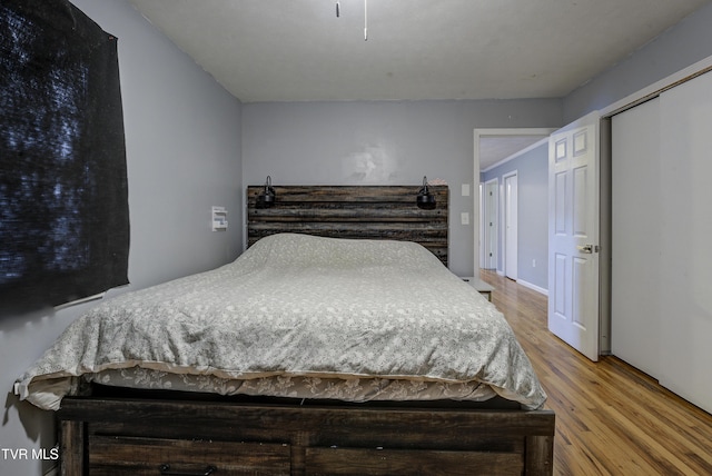 bedroom featuring wood finished floors