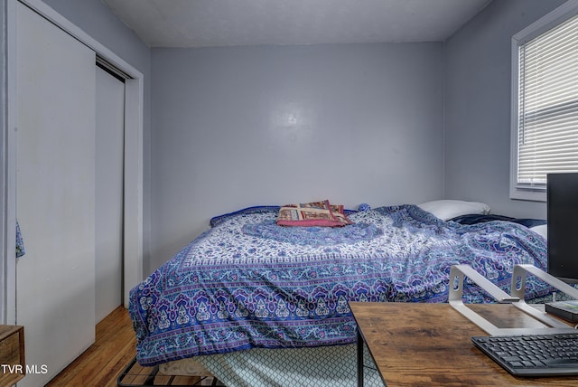 bedroom with wood finished floors