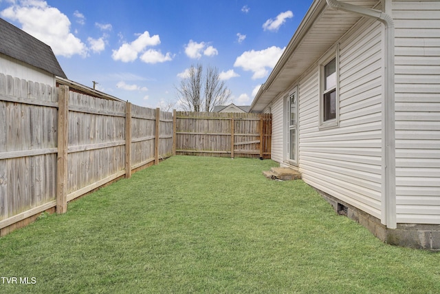 view of yard with a fenced backyard