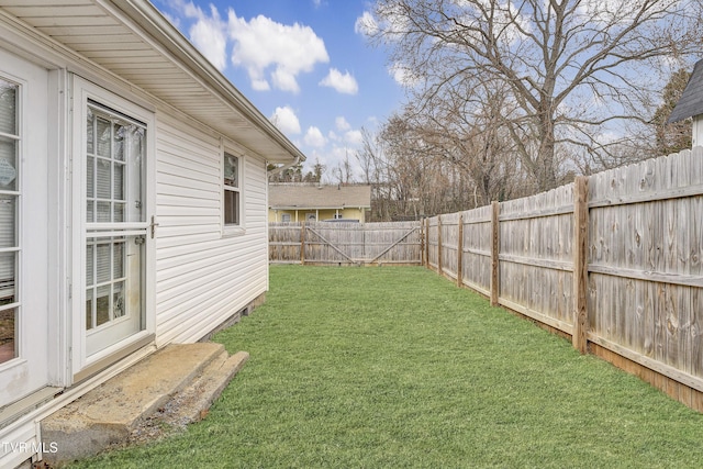 view of yard with a fenced backyard