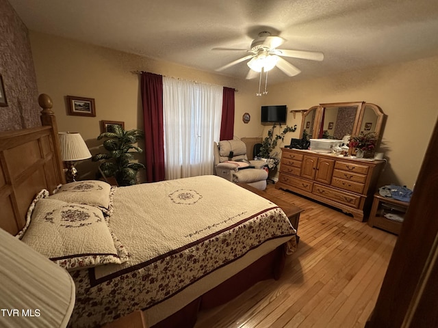 bedroom featuring a ceiling fan and light wood-style floors