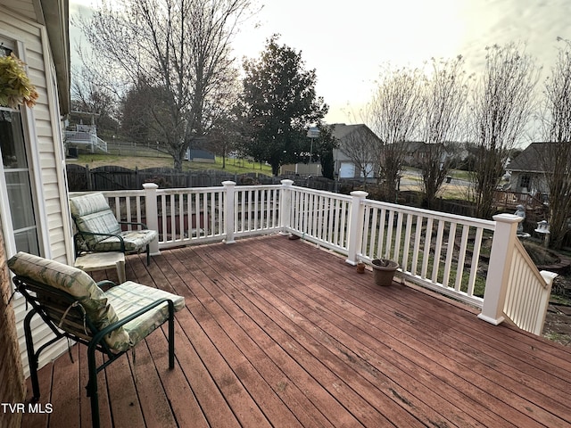 deck with a fenced backyard