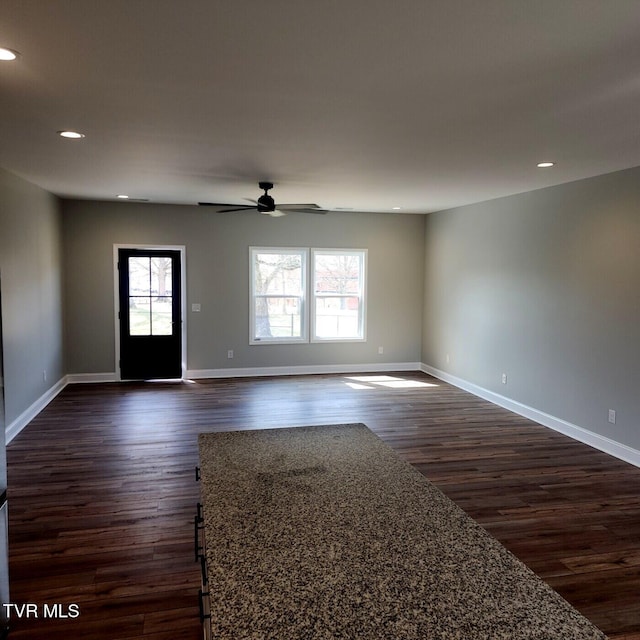 interior space featuring recessed lighting, baseboards, dark wood-type flooring, and a ceiling fan