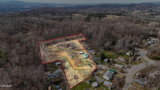 aerial view with a wooded view