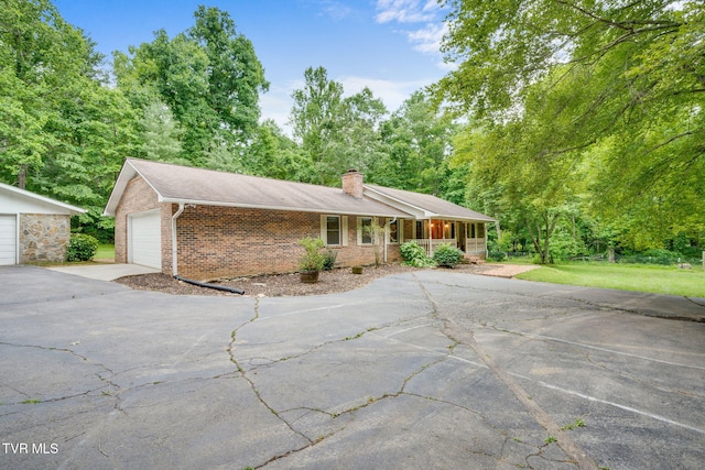 631 Bowmantown Rd, Telford, TN 37690 - ranch-style house with brick siding, a chimney, driveway, and a porch