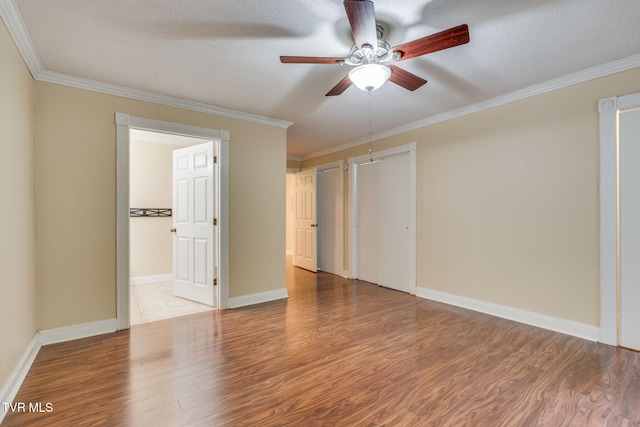 631 Bowmantown Rd, Telford, TN 37690 - empty room with ceiling fan, wood finished floors, crown molding, and baseboards