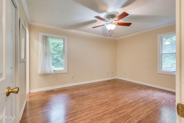 631 Bowmantown Rd, Telford, TN 37690 - unfurnished room with wood finished floors, a ceiling fan, a textured ceiling, ornamental molding, and baseboards
