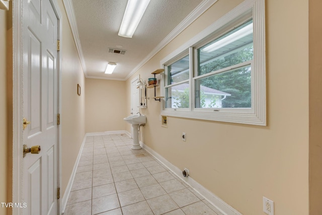 631 Bowmantown Rd, Telford, TN 37690 - hallway featuring light tile patterned floors, ornamental molding, a textured ceiling, and baseboards