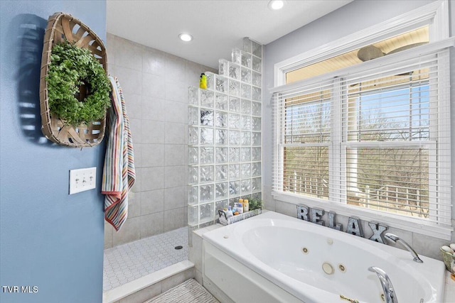 full bathroom with recessed lighting, a tub with jets, and a walk in shower